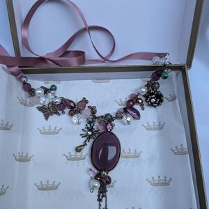 Elegant purple and Gold Necklace by William Ashley fine china. Never worn.